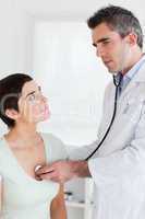 Doctor examining a charming woman