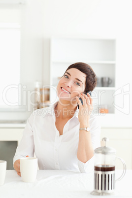 Cute woman on phone in the morning