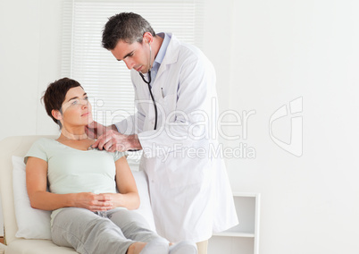 Male Doctor examining a patient