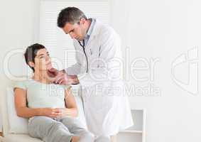 Male Doctor examining a patient