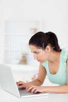 Young woman focusedon laptop