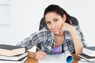 Cute young student doing homework