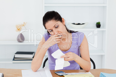 Stressed young woman doing banking