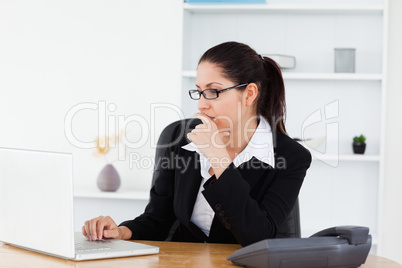 A serious young businesswoman in her office