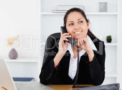 Beautiful businesswoman on telephone