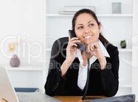 Beautiful businesswoman on telephone