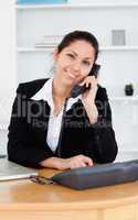 Smiling businesswoman on telephone