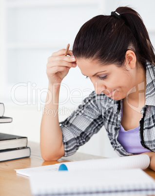 Young student focusing on homework