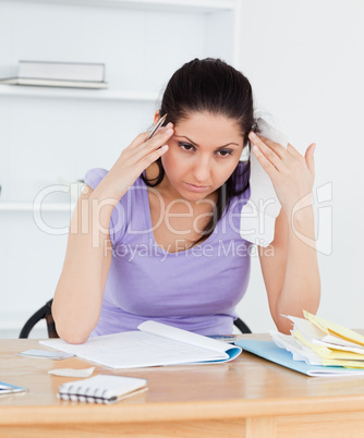 Young accounting woman having a headache