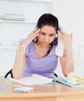 Young accounting woman having a headache