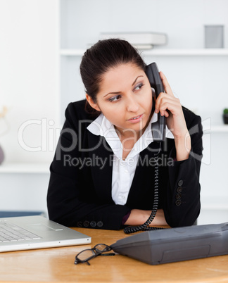 Businesswoman telephoning in office