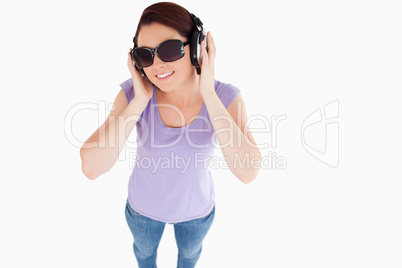 Smiling Woman with headphones and sunglasses