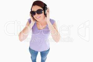 Smiling Woman with headphones and sunglasses