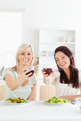 Young Women toasting with wine