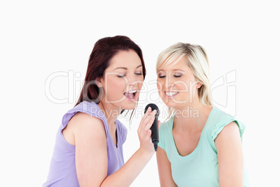 Joyful Women singing karaoke