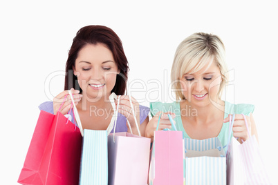 Happy young women with shopping bags Happy young women with shopping bags