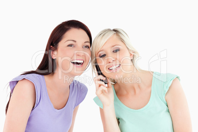 Laughing women on the phone