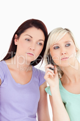 Portrait of serious women on the phone