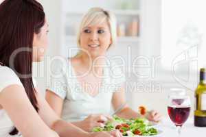 Portrait of happy Women eating salad