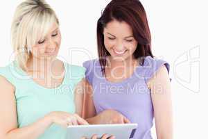 Portrait of cute women with a tablet