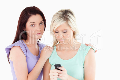 Portrait of upset women with a cellphone