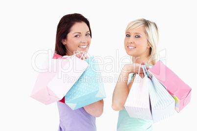 Cheerful women with shopping bags