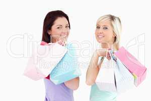 Cheerful women with shopping bags