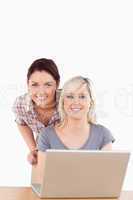 Portrait of smiling women with a laptop