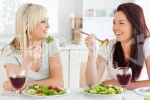 Cheerful Women eating salad