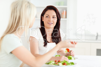 Portrait of young Women eating salad