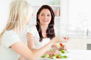 Portrait of young Women eating salad