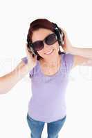 Young Woman with headphones and sunglasses