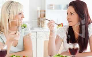 Joyful Women eating salad