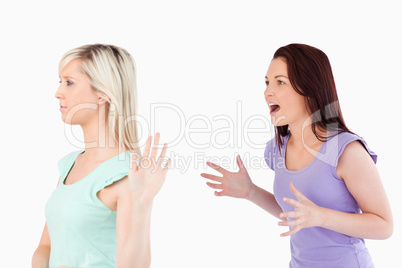 Young woman ignoring a yelling lady