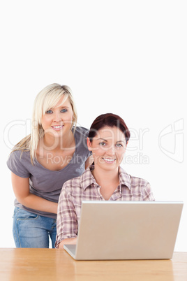 Portrait of cute women with a laptop