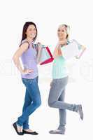 Joyful women with shopping bags