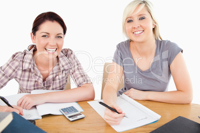 Pretty women learning at table