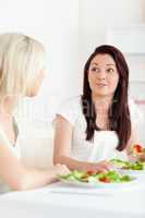 Portrait of amazed Women eating salad