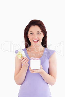 Cheering woman opening a box