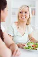 Close up of Smiling Women eating salad