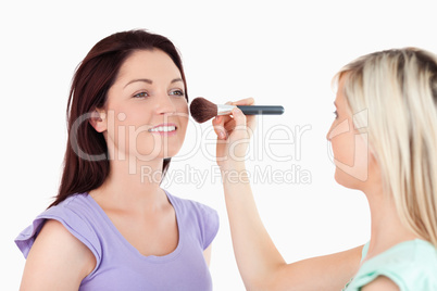 Beautiful Women applying make-up