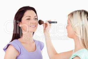 Beautiful Women applying make-up