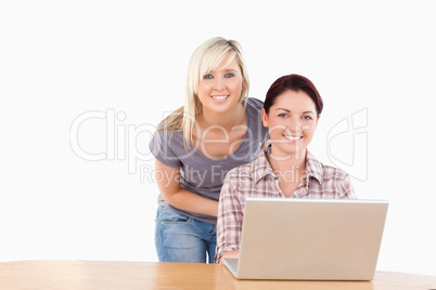 Portrait of gorgeous women with a laptop