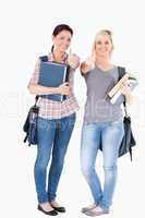 Portrait of smiling College students holding books