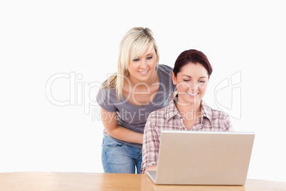 Portrait of joyful women with a laptop