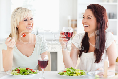 Young women drinking wine