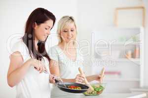 Gorgeous Women cooking dinner