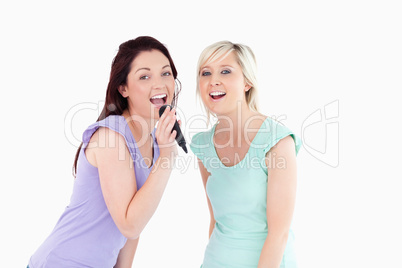 Women singing karaoke