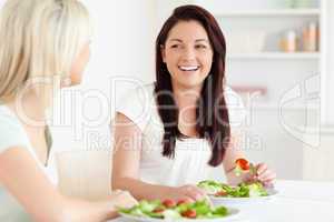 Portrait of laughing Women eating salad