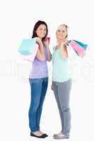 Smiling women with shopping bags